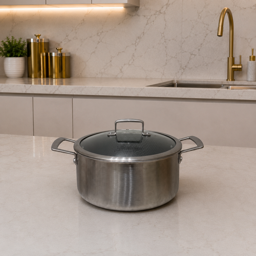 Stainless steel pot with lid on a kitchen counter
